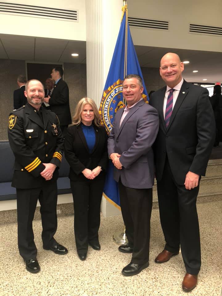 Major G. Strathmann (left), Capt. J. Stafford, Capt. W. James (Ret.), and Sheriff Jim O'Sullivan post at the FBI National Academy graduation in Quantico, Virginia.